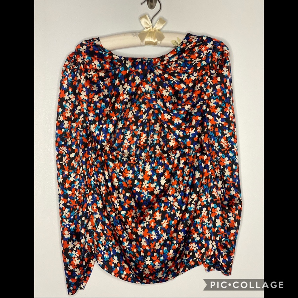 Floral print polyester top. Gently used.